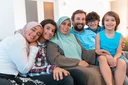 portrait-photo-arab-muslim-family-sitting-couch-living-room-large-modern-house-selective-focus-portrait-234681891.webp